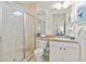 Bathroom with a tile shower and vanity at 600 Bayway Blvd # 504, Clearwater Beach, FL 33767