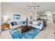 Cozy living room showcasing comfortable seating, a rustic coffee table, and an open layout connecting to the dining area at 600 Bayway Blvd # 504, Clearwater Beach, FL 33767