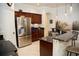 Kitchen featuring stainless steel appliances, granite countertops, breakfast bar, and modern fixtures at 6931 Surrey Hill Pl, Apollo Beach, FL 33572