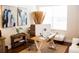 Cozy home office with desk, artwork, and natural light from a bright window at 6931 Surrey Hill Pl, Apollo Beach, FL 33572