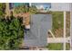 Aerial view of a home showing the roof, landscaping, and surrounding neighborhood at 8421 Millwood Dr, Tampa, FL 33615