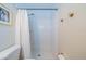 Bright bathroom featuring a small toilet room with white tiling and gold fixtures at 8421 Millwood Dr, Tampa, FL 33615
