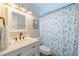 Bright bathroom featuring a vanity with drawers and a tub with a floral shower curtain at 8421 Millwood Dr, Tampa, FL 33615