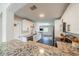 Bright kitchen featuring granite countertops, stainless steel appliances, and modern cabinetry at 8421 Millwood Dr, Tampa, FL 33615