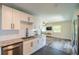 Updated kitchen with granite countertops and stainless steel appliances, open to the living area at 8421 Millwood Dr, Tampa, FL 33615