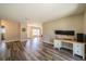 Spacious living room with laminate flooring, with a view to the kitchen, dining and front entrance at 8421 Millwood Dr, Tampa, FL 33615