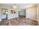 Bright living room featuring laminate flooring and an opening to the kitchen, providing ample space to entertain at 8421 Millwood Dr, Tampa, FL 33615