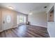 Sunny living room with hardwood floors and bay window, complemented by a contemporary chandelier and abundant natural light at 8421 Millwood Dr, Tampa, FL 33615