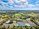 Aerial view of a community with tennis courts, lush landscaping and beautiful views at 8703 Bardmoor Blvd # 304, Seminole, FL 33777