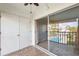 View from balcony overlooking community pool with tile flooring and a sliding glass door at 8703 Bardmoor Blvd # 304, Seminole, FL 33777