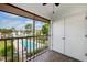 View from balcony overlooking the community pool with tile flooring and screen enclosure at 8703 Bardmoor Blvd # 304, Seminole, FL 33777
