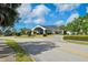 Welcoming clubhouse featuring a well-maintained exterior and beautifully landscaped surroundings at 8703 Bardmoor Blvd # 304, Seminole, FL 33777
