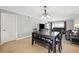 Open dining area featuring neutral walls, stylish lighting, and hardwood floors at 8703 Bardmoor Blvd # 304, Seminole, FL 33777