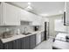 Beautiful kitchen features stainless steel appliances and stone countertops at 8703 Bardmoor Blvd # 304, Seminole, FL 33777