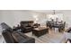 Inviting living room and dining room area, with leather sofa seating at 8703 Bardmoor Blvd # 304, Seminole, FL 33777