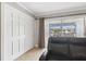 Living Room features built in closet and balcony access with exterior views at 8703 Bardmoor Blvd # 304, Seminole, FL 33777