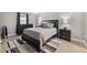 Spacious main bedroom featuring a large bed, side tables, lamps, and a decorative rug at 8703 Bardmoor Blvd # 304, Seminole, FL 33777