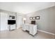 Home office area with neutral colors, tiled floors, bright lighting, and convenient storage at 8703 Bardmoor Blvd # 304, Seminole, FL 33777