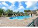 Relaxing pool area with lounge chairs, mature landscaping, and a cabana for the ultimate leisure at 8703 Bardmoor Blvd # 304, Seminole, FL 33777