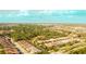 Lovely aerial view of the neighborhood showcasing gorgeous green spaces and landscaping at 8732 Rain Song Rd, Sarasota, FL 34238