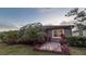 Inviting backyard with a screened patio, lush landscaping, and a serene atmosphere at 8732 Rain Song Rd, Sarasota, FL 34238