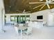 Clubhouse with seating area, bar, and ceiling fans at 8732 Rain Song Rd, Sarasota, FL 34238