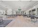 Expansive community room with bar-style seating, lounge area and serene design at 8732 Rain Song Rd, Sarasota, FL 34238