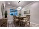 Dining room with dining table, chairs and modern lighting and wall decor at 8732 Rain Song Rd, Sarasota, FL 34238