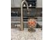 Close-up of stainless faucet and countertop, adding elegance to the kitchen space at 8732 Rain Song Rd, Sarasota, FL 34238