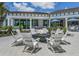 Inviting outdoor fire pit area with comfortable seating and stylish community building at 8732 Rain Song Rd, Sarasota, FL 34238
