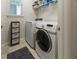 Functional laundry room featuring new front loading washer and dryer at 8732 Rain Song Rd, Sarasota, FL 34238