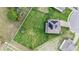 Aerial shot showcasing a large backyard, solar panels on the roof, and a desirable neighborhood at 9843 Cabernet Ave, Seffner, FL 33584