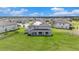 Spacious backyard with covered patio, solar panels on roof; ideal for outdoor entertaining at 9843 Cabernet Ave, Seffner, FL 33584