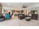Open-concept home with a living room, dining area, and kitchen seamlessly connected for modern living at 9843 Cabernet Ave, Seffner, FL 33584