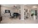 Spacious office with herringbone floors, multiple monitors, ceiling fan and ample natural light at 9843 Cabernet Ave, Seffner, FL 33584