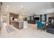 Open floorplan connecting kitchen, living, and dining areas with modern finishes at 9843 Cabernet Ave, Seffner, FL 33584