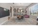 Bright playroom with custom built-ins, round table, area rug and a large window for ample natural light at 9843 Cabernet Ave, Seffner, FL 33584