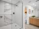 Modern bathroom boasts walk-in glass shower, marble tile and modern fixtures at 100 4Th S Ave # 132, St Petersburg, FL 33701