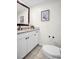 Bright bathroom features a vanity with granite countertops and dark fixtures at 100 4Th S Ave # 132, St Petersburg, FL 33701