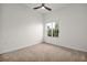 Bedroom with neutral carpet, a ceiling fan, and a window providing natural light at 100 4Th S Ave # 132, St Petersburg, FL 33701