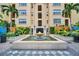 An elegant fountain centered in a manicured courtyard offers a tranquil entrance at 100 4Th S Ave # 132, St Petersburg, FL 33701