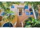 Attractive exterior of a multi-story building with balconies and lush tropical landscaping at 100 4Th S Ave # 132, St Petersburg, FL 33701