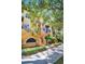Exterior of a building with palm trees, balconies, and landscaping at 100 4Th S Ave # 132, St Petersburg, FL 33701