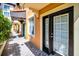 Exterior of a building with brick path, covered walkway, and entry doors at 100 4Th S Ave # 132, St Petersburg, FL 33701
