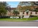 Mirror Lake Community Library featuring a manicured lawn, statue, and charming architecture at 100 4Th S Ave # 132, St Petersburg, FL 33701