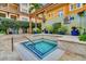 Cozy spa with tile accents, lush landscaping, and clear signage at 100 4Th S Ave # 132, St Petersburg, FL 33701