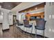 Modern kitchen bar with seating, granite countertops, and stainless steel appliances at 100 4Th S Ave # 132, St Petersburg, FL 33701