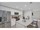 Modern kitchen with white cabinets, stainless steel appliances, and a spacious island with seating at 100 4Th S Ave # 132, St Petersburg, FL 33701