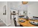 Open concept kitchen and dining area, featuring modern appliances and white cabinetry at 100 4Th S Ave # 132, St Petersburg, FL 33701