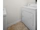 Laundry room featuring a white dryer and tile floor at 100 4Th S Ave # 132, St Petersburg, FL 33701